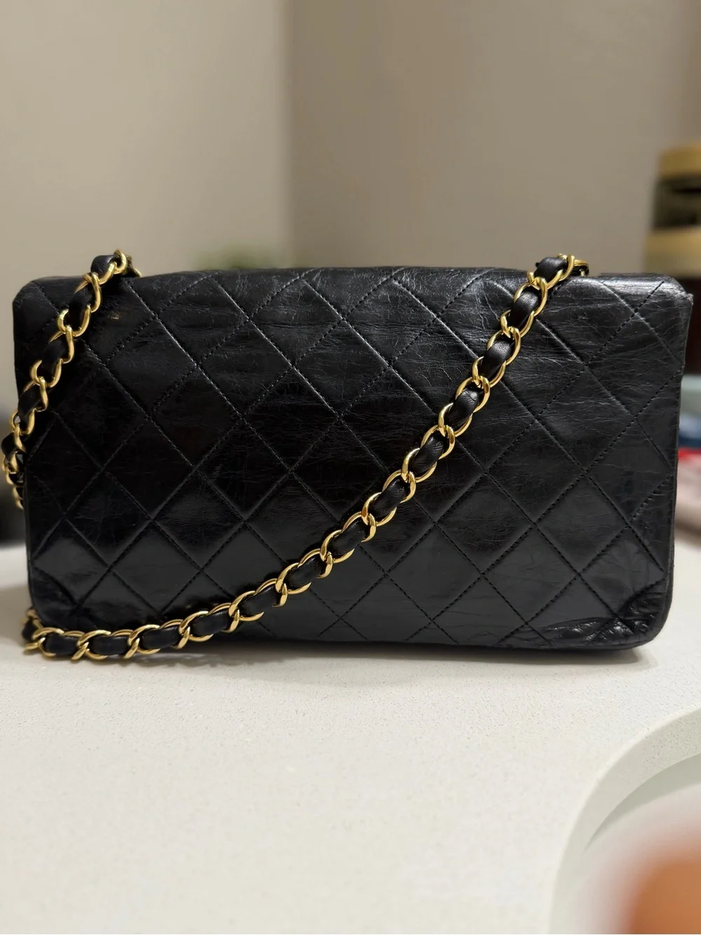 CHANEL Black Quilted Shoulder Bag with Gold CC Lock
